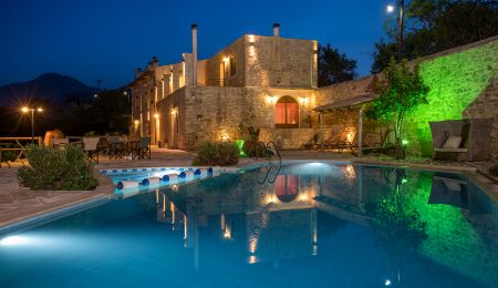 villa and pool at night